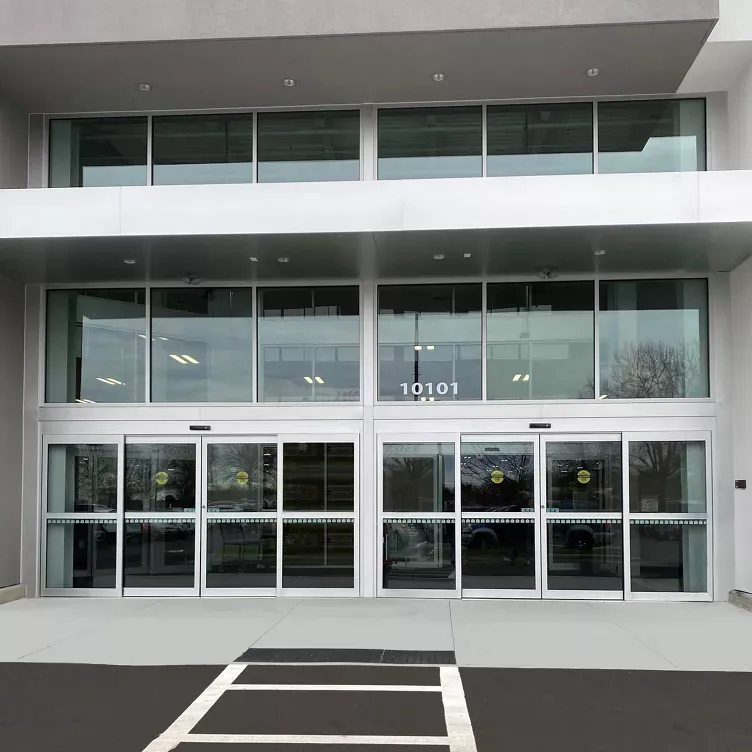 Record bi-parting automatic sliding door system